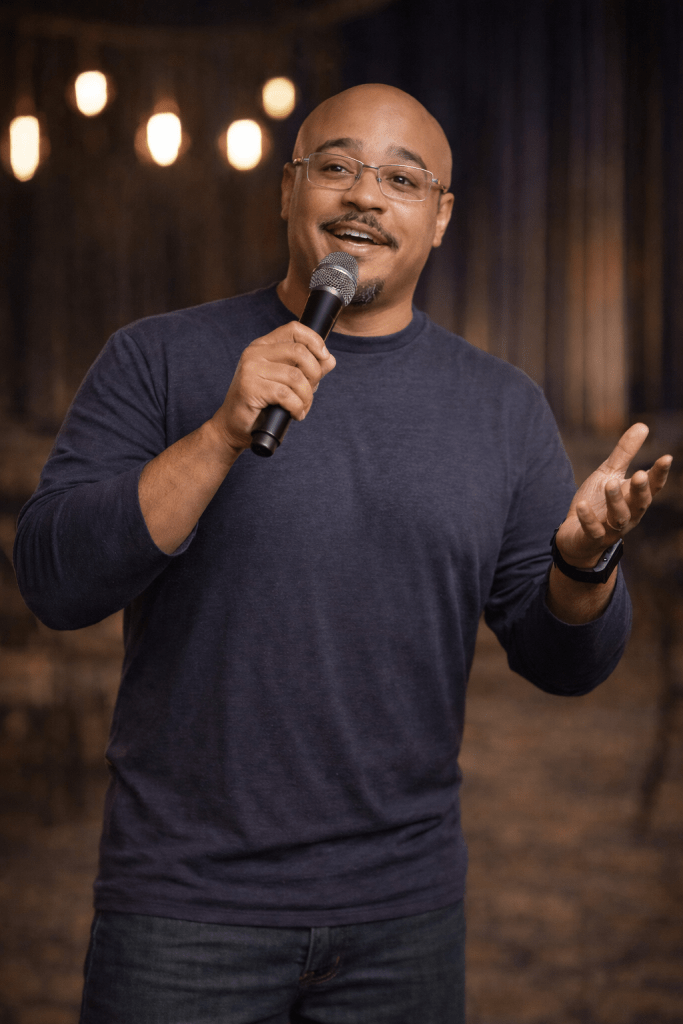 Trivia host speaking to a crowd